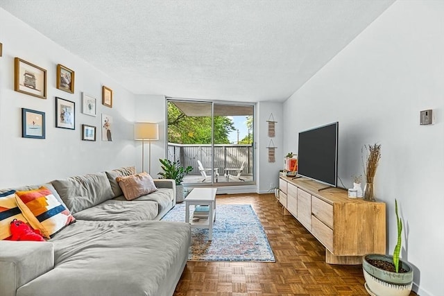 19 Winchester St Unit 102, Brookline, MA 02446 - living area featuring a textured ceiling and floor to ceiling windows