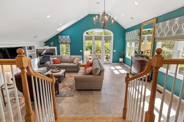 134 Reed Farm Rd, Boxborough, MA 01719 - living room with healthy amount of natural light, a fireplace, vaulted ceiling, a chandelier, and built in features