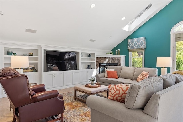 134 Reed Farm Rd, Boxborough, MA 01719 - living room featuring a skylight, vaulted ceiling, a high end fireplace, and built in shelves
