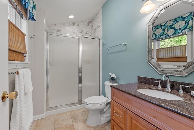 134 Reed Farm Rd, Boxborough, MA 01719 - full bathroom featuring a shower stall, vanity, tile patterned floors, and toilet