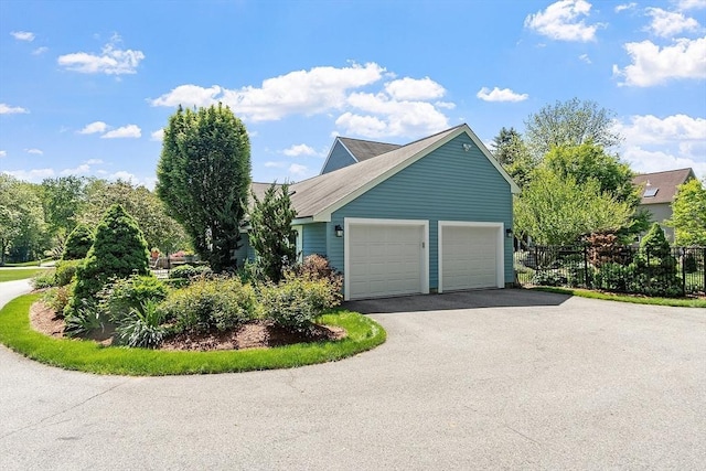 134 Reed Farm Rd, Boxborough, MA 01719 - view of side of property with driveway and an attached garage