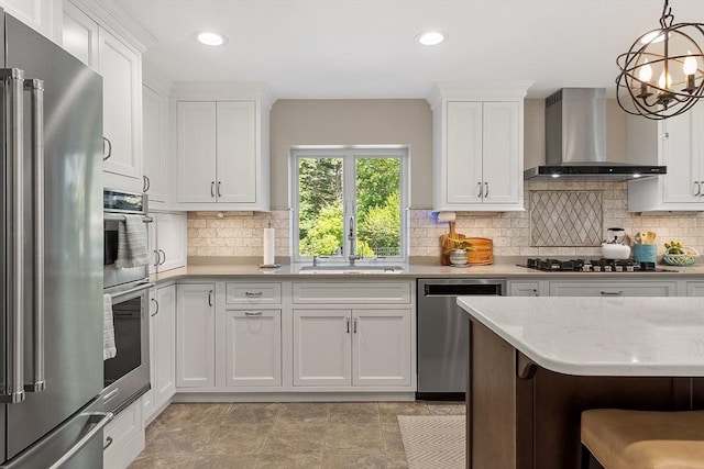 134 Reed Farm Rd, Boxborough, MA 01719 - kitchen with stainless steel appliances, wall chimney exhaust hood, a sink, white cabinets, and tasteful backsplash