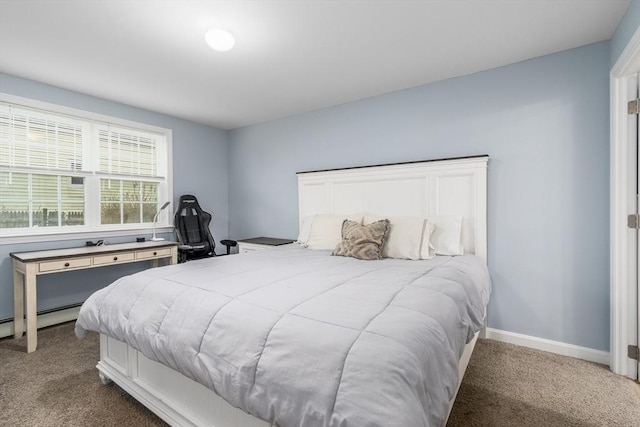 carpeted bedroom featuring baseboard heating