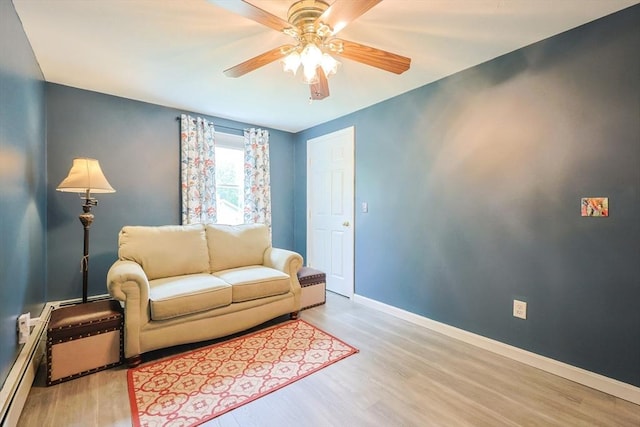 421 Gray Ter, Dighton, MA 02764 - living room with wood finished floors, a ceiling fan, and baseboard heating