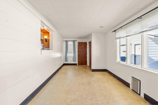 empty room featuring baseboards