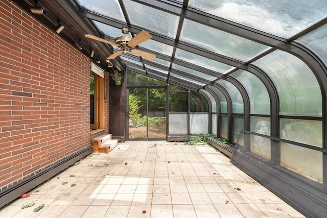 260 Landham Rd, Sudbury, MA 01776 - unfurnished sunroom with a baseboard radiator, ceiling fan, and vaulted ceiling