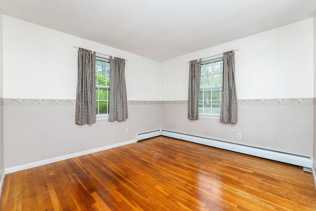378 Linebrook Rd, Ipswich, MA 01938 - unfurnished room with wood finished floors, baseboard heating, and baseboards