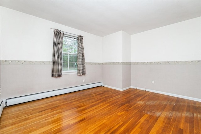 378 Linebrook Rd, Ipswich, MA 01938 - empty room with a baseboard radiator, wood-type flooring, and baseboards