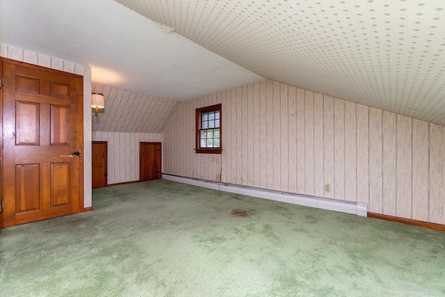 378 Linebrook Rd, Ipswich, MA 01938 - bonus room with a baseboard heating unit, carpet flooring, vaulted ceiling, baseboards, and wooden walls