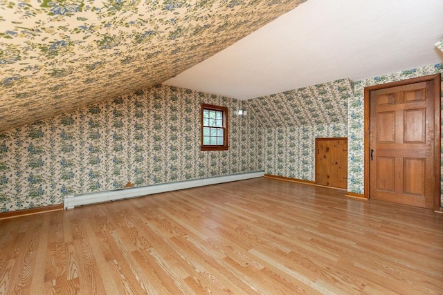 378 Linebrook Rd, Ipswich, MA 01938 - bonus room with wallpapered walls, light wood finished floors, baseboards, baseboard heating, and lofted ceiling