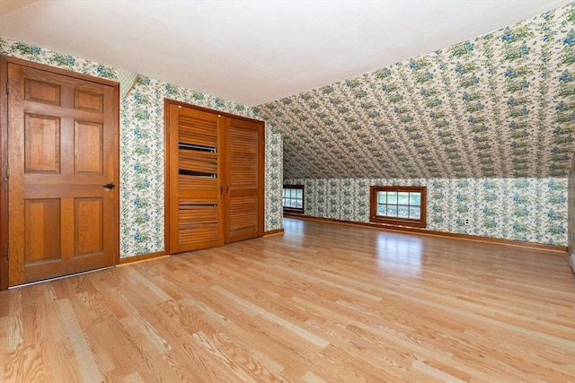378 Linebrook Rd, Ipswich, MA 01938 - additional living space with wallpapered walls, wood finished floors, and baseboards