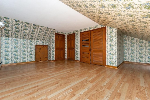 378 Linebrook Rd, Ipswich, MA 01938 - additional living space with wallpapered walls, light wood-type flooring, and baseboards