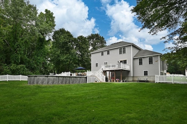 100 Overlook Ter, Dracut, MA 01826 - back of house featuring a wooden deck, an outdoor pool, stairs, and roof with shingles