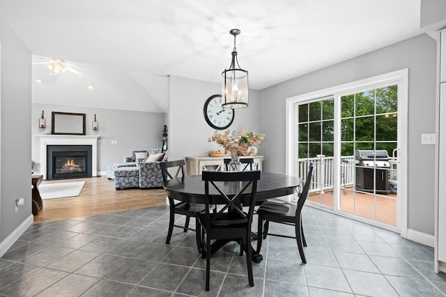 100 Overlook Ter, Dracut, MA 01826 - tiled dining room with a glass covered fireplace and recessed lighting