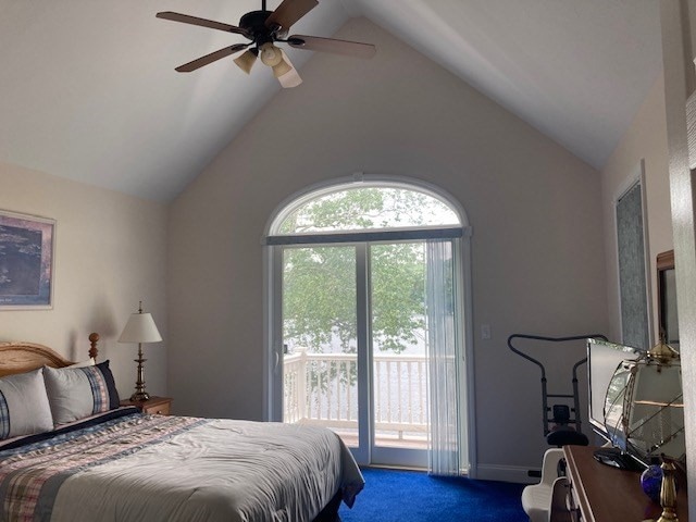 carpeted bedroom with access to outside, ceiling fan, and lofted ceiling