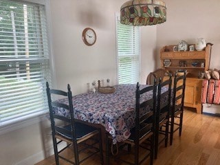 dining space with hardwood / wood-style floors