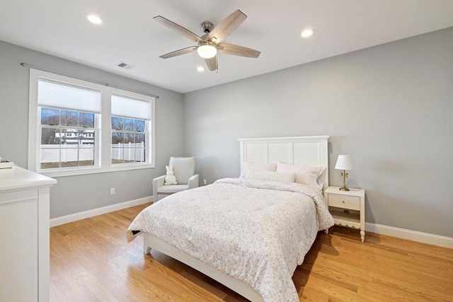 bedroom with light wood-style floors, baseboards, visible vents, and recessed lighting