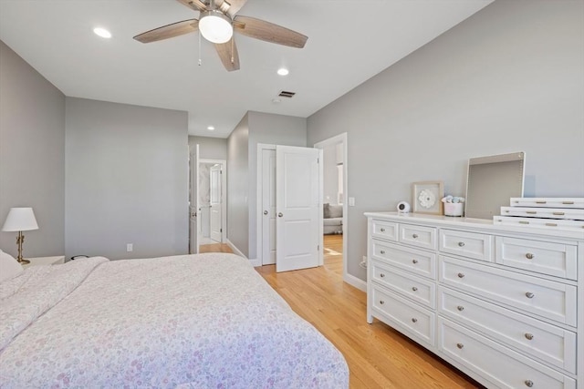 bedroom with ceiling fan, visible vents, recessed lighting, light wood finished floors, and baseboards