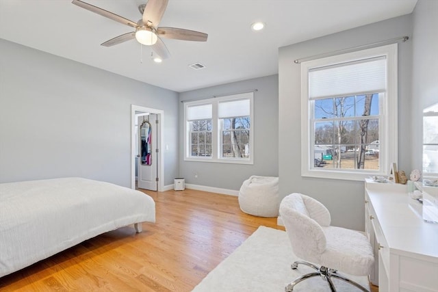 bedroom with baseboards, recessed lighting, a ceiling fan, light wood-style floors, and visible vents