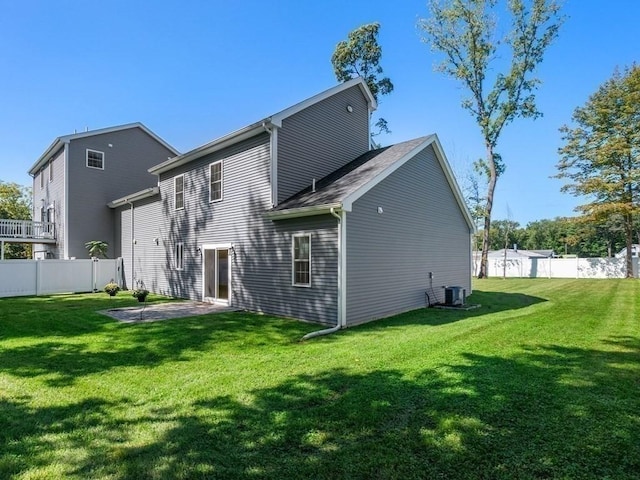 back of house with a yard, a patio, fence, and central AC unit