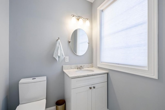 bathroom with toilet and vanity