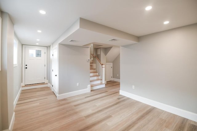 foyer entrance with light wood-type flooring