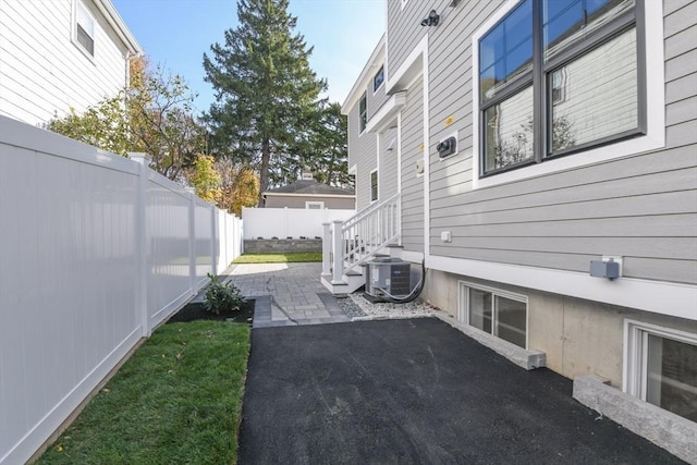 exterior space with a patio area and central AC unit