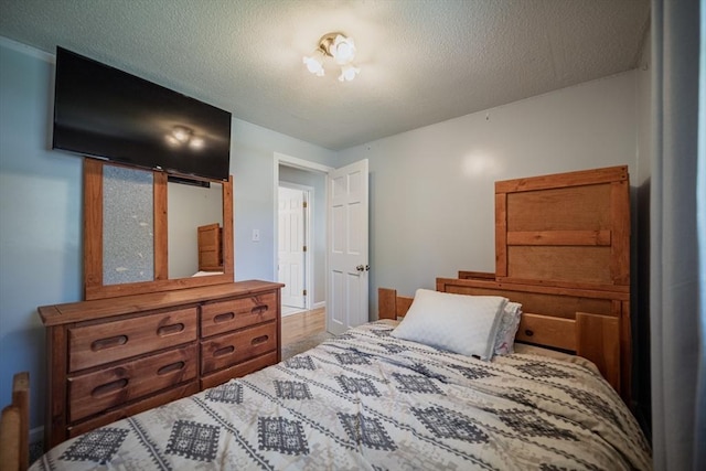 bedroom featuring a textured ceiling