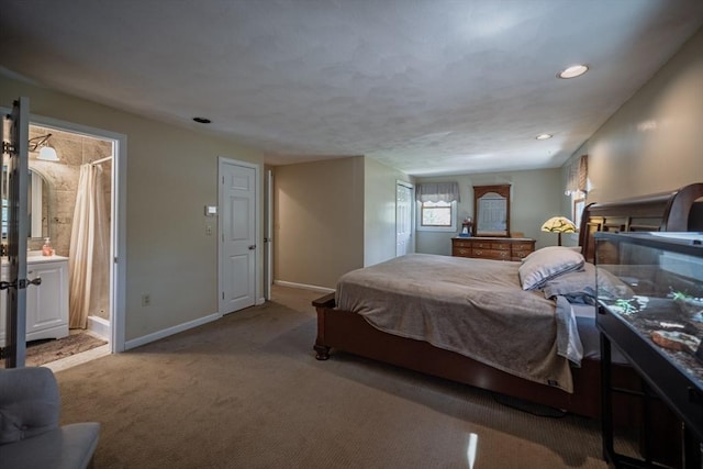 carpeted bedroom with baseboards, a fireplace, recessed lighting, and connected bathroom