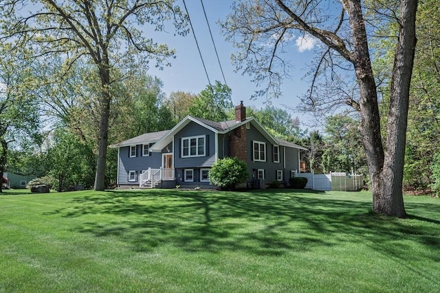 view of front of home featuring a chimney