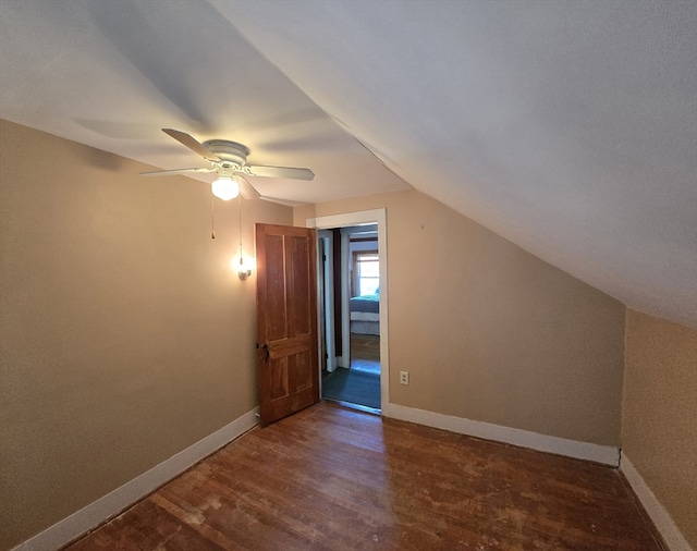 bonus room with ceiling fan, lofted ceiling, and dark hardwood / wood-style flooring