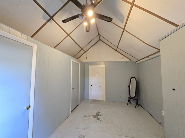 interior space with lofted ceiling and ceiling fan