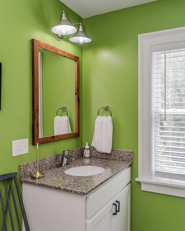 bathroom with healthy amount of natural light and vanity