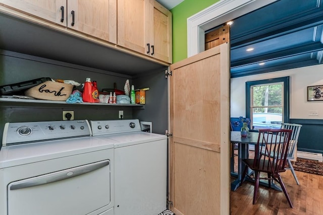 washroom featuring cabinet space, washing machine and dryer, wood finished floors, and recessed lighting