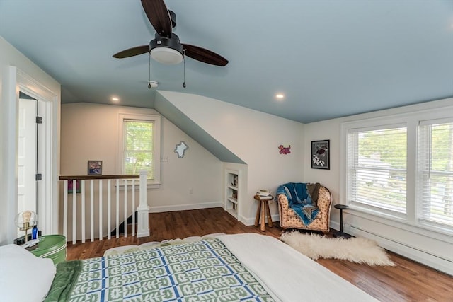 bedroom with wood finished floors, a baseboard radiator, baseboards, recessed lighting, and a ceiling fan