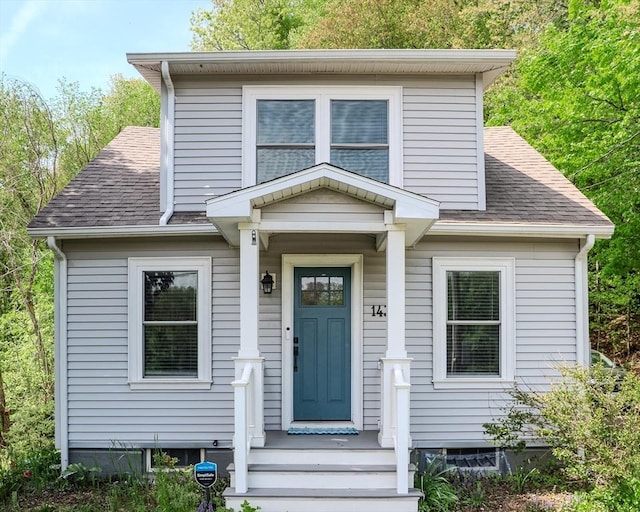 view of front of house with roof with shingles