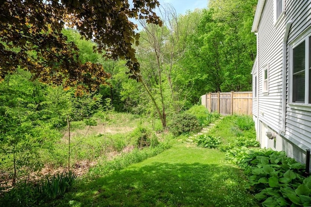 view of yard with a wooded view