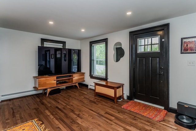 foyer entrance with wood finished floors, recessed lighting, and baseboard heating