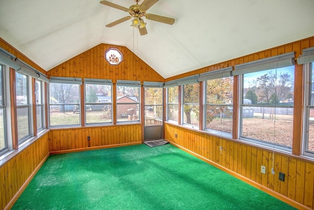 unfurnished sunroom featuring ceiling fan and vaulted ceiling