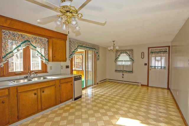 kitchen with a baseboard heating unit, ceiling fan with notable chandelier, plenty of natural light, and sink