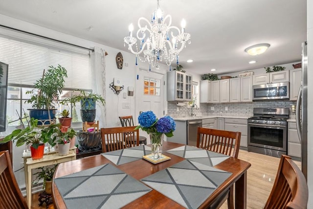 80 Messinger St, Boston, MA 02126 - dining area with a chandelier and light wood-style flooring