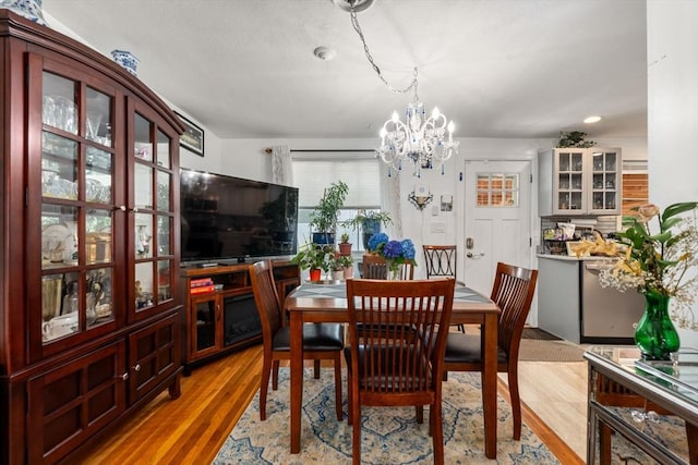 80 Messinger St, Boston, MA 02126 - dining room with a chandelier and light wood finished floors