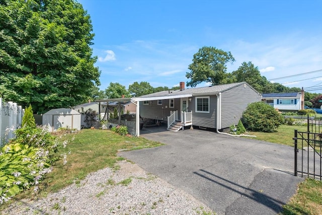 80 Messinger St, Boston, MA 02126 - rear view of property featuring a chimney, driveway, and a carport
