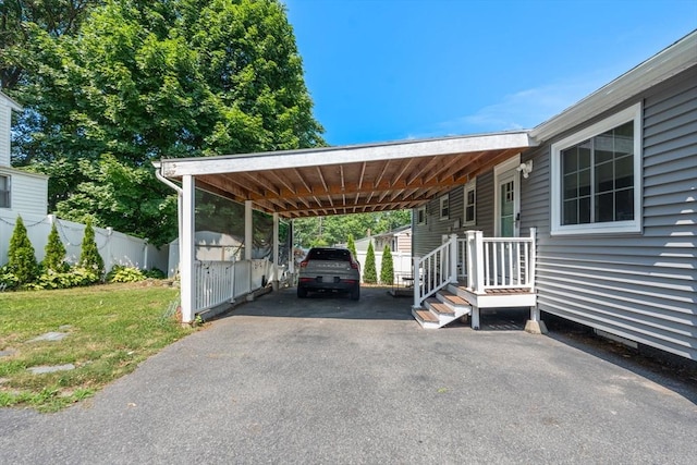 80 Messinger St, Boston, MA 02126 - view of parking / parking lot featuring asphalt driveway and an attached carport