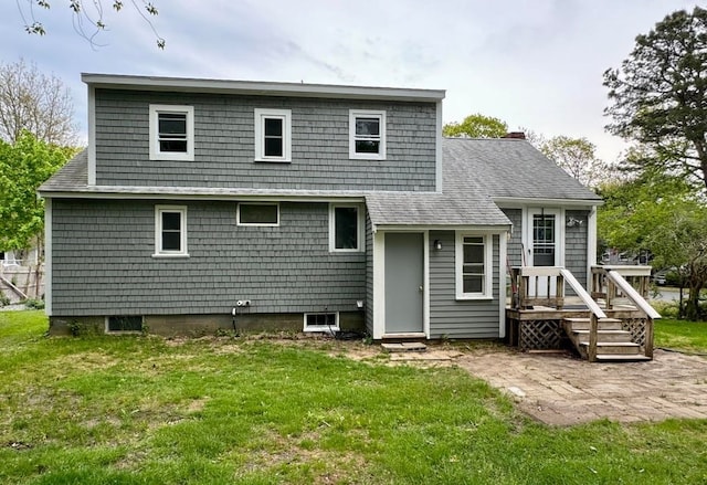 rear view of house with a lawn