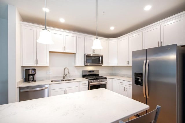 120 University Ave Unit 2202, Westwood, MA 02090 - kitchen with appliances with stainless steel finishes, white cabinetry, pendant lighting, and recessed lighting