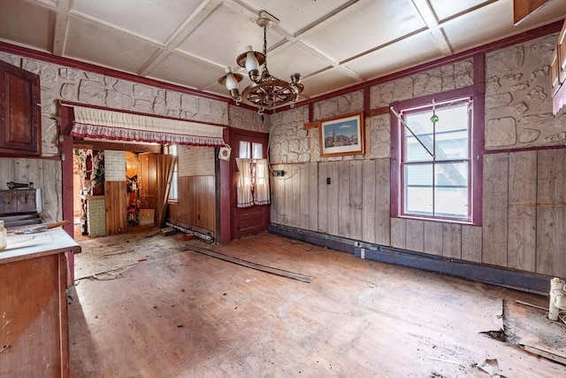 interior space with an inviting chandelier and coffered ceiling