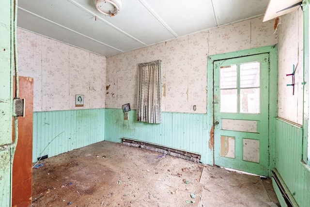 empty room with a baseboard heating unit