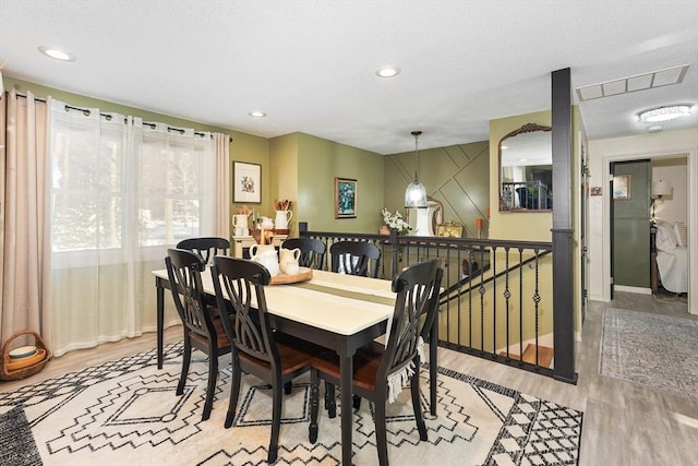 dining area with light hardwood / wood-style flooring