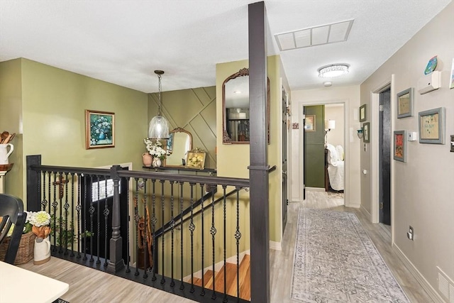 corridor featuring light hardwood / wood-style floors